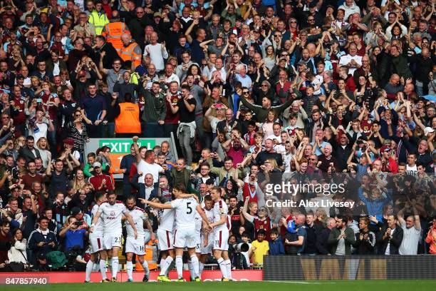 Scott Arfield of Burnley celebrates scoring his sides first goal with his Burnley team mates and the Burnley fans during the Premier League match...