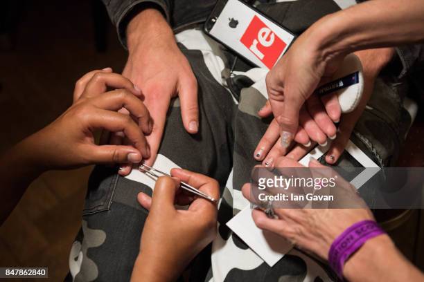 Fingernails are prepared backstage ahead of the Dans La Vie Rira Sugawara show during London Fashion Week September 2017 on September 16, 2017 in...