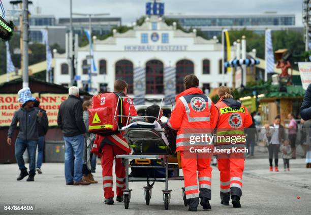 Paramedics care for a drunken man during the first day of the 2017 Oktoberfest beer fest on September 16, 2017 in Munich, Germany. Oktoberfest is the...