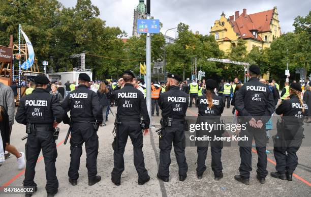 Police officers stand at a official entrance during the first day of the 2017 Oktoberfest beer fest on September 16, 2017 in Munich, Germany....