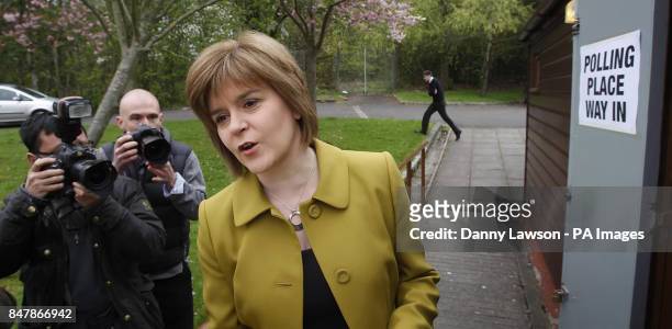 Deputy Leader Nicola Sturgeon arrives to cast her vote at Broomhouse Halls polling station in Glasgow, as Scots go to the polls today to elect their...