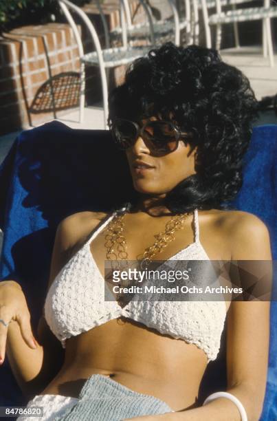 Actress Pam Grier sits by the pool circa 1975 in Los Angeles, California.
