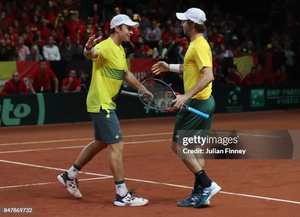 John Peers and Jordan Thompson of Australia celebrate at match point in the doubles match against Ruben Bemelmans and Arthur De Greef of Belgium...