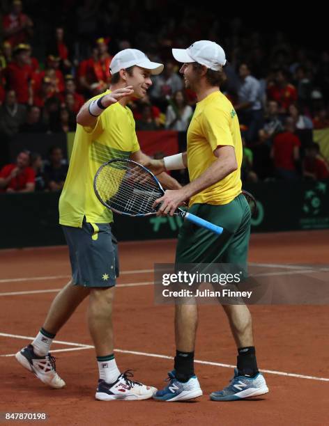 John Peers and Jordan Thompson of Australia celebrate at match point in the doubles match against Ruben Bemelmans and Arthur De Greef of Belgium...