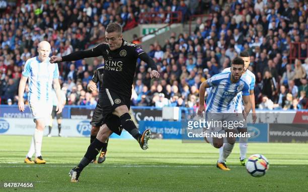 Jamie Vardy of Leicester City scores his sides first goal from the penalty spot during the Premier League match between Huddersfield Town and...
