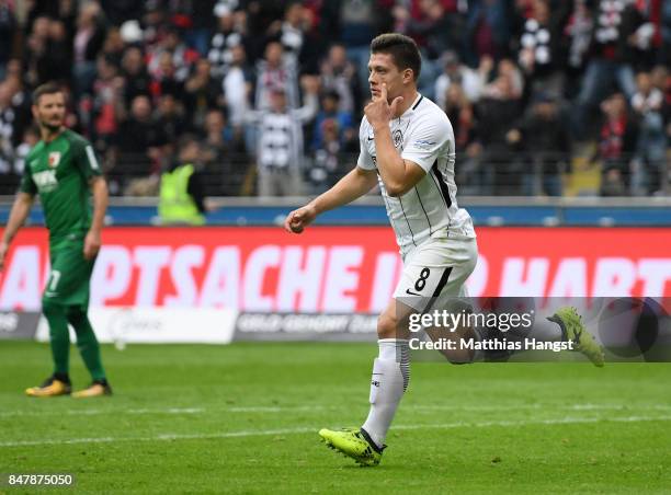 Luka Jovic of Frankfurt celebrates after scoring his team's first goal during the Bundesliga match between Eintracht Frankfurt and FC Augsburg at...