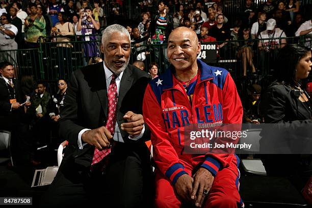 Legend Julius Erving talks with Harlem Globetrotter Curly Neal during the McDonald's All-Star Celebrity Game on center court during NBA Jam Session...