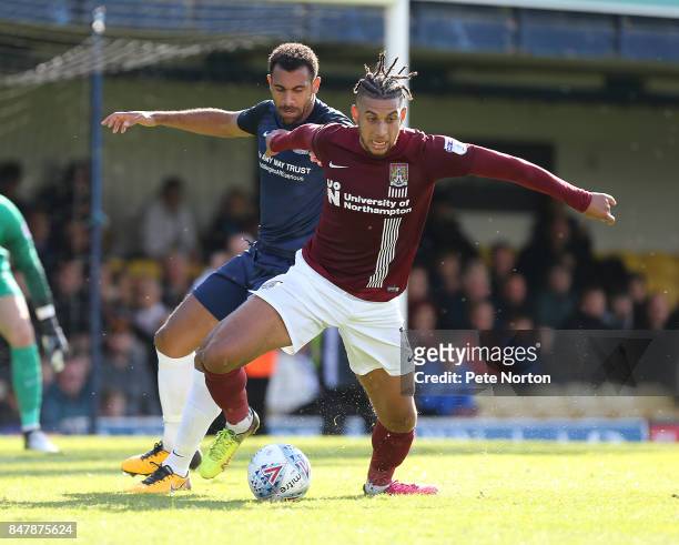 Daniel Powell of Northampton Town controls the ball watched by Anton Ferdinand of Southend United during the Sky Bet League One match between...
