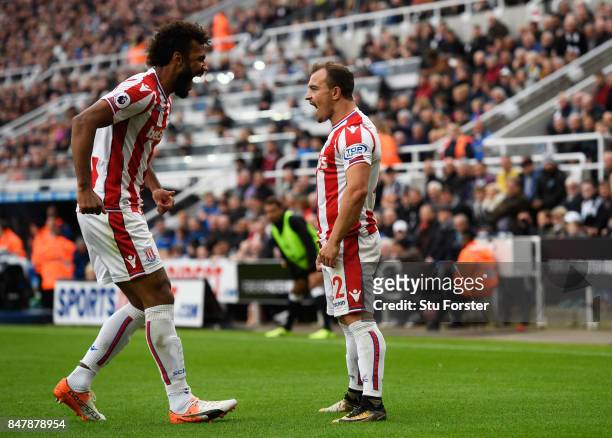 Xherdan Shaqiri of Stoke City celebrates scoring his sides first goal with Maxim Choupo-Moting of Stoke City during the Premier League match between...