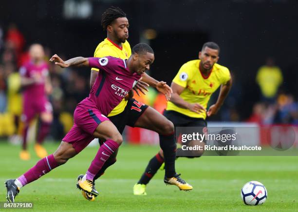 Raheem Sterling of Manchester City and Nathaniel Chalobah of Watford battle for possession during the Premier League match between Watford and...