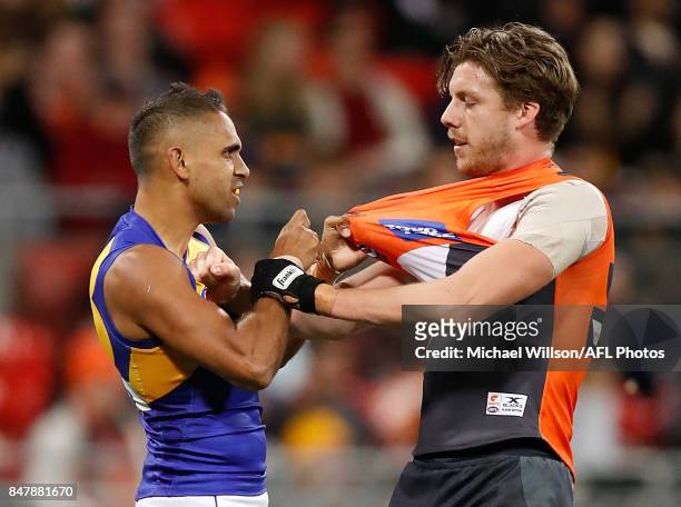 Lewis Jetta of the Eagles and Aidan Corr of the Giants clash during the 2017 AFL First Semi Final match between the GWS Giants and the West Coast...