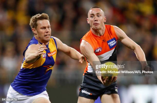 Tom Scully of the Giants and Sam Mitchell of the Eagles in action during the 2017 AFL First Semi Final match between the GWS Giants and the West...