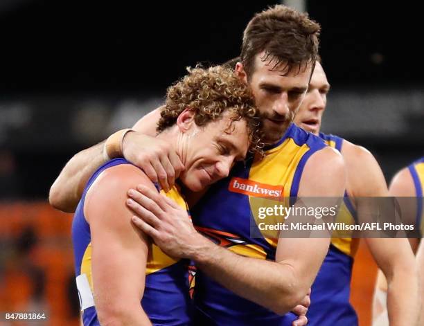 Matt Priddis of the Eagles is embraced by teammate Eric Mackenzie after his final match during the 2017 AFL First Semi Final match between the GWS...