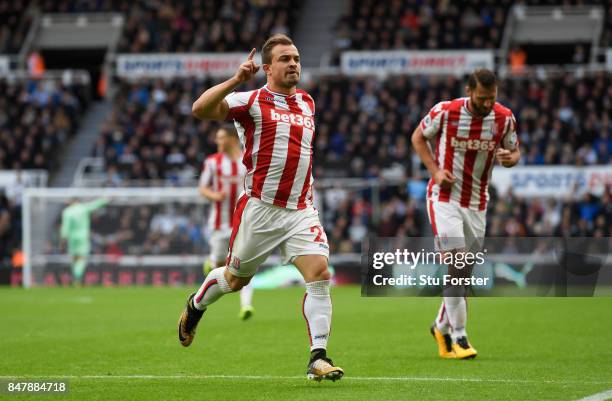 Xherdan Shaqiri of Stoke City celebrates scoring his sides first goal during the Premier League match between Newcastle United and Stoke City at St....