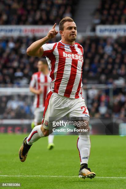 Xherdan Shaqiri of Stoke City celebrates scoring his sides first goal during the Premier League match between Newcastle United and Stoke City at St....