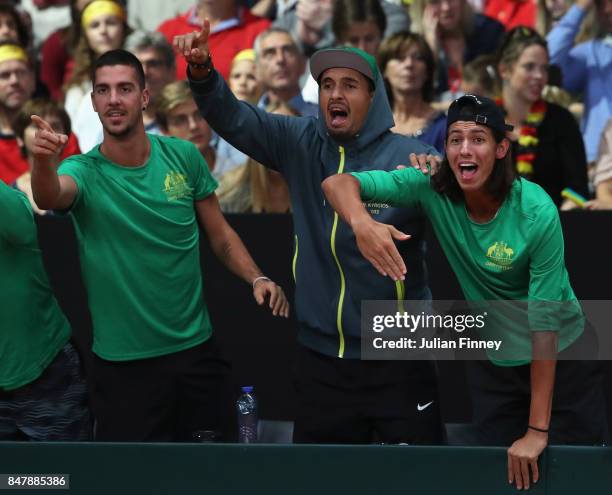 Nick Kyrgios, Thanasi Kokkinakis and Alexei Popyrin of Australia celebrate a point as John Peers and Jordan Thompson of Australia play in the doubles...