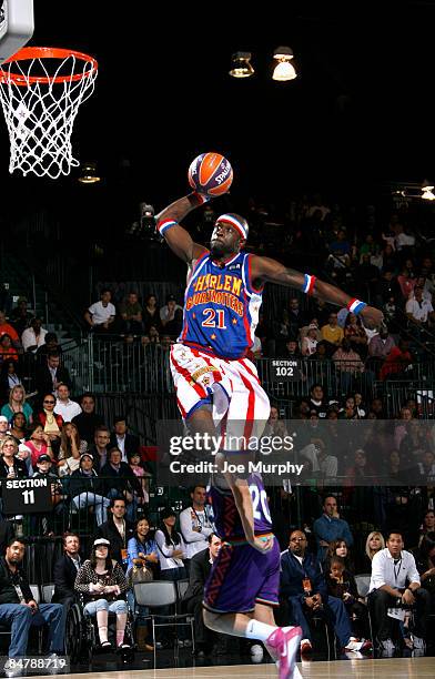 Harlem Globetrotter Special K Daley dunks during the McDonald's All-Star Celebrity Game on center court during NBA Jam Session Presented by Adidas on...