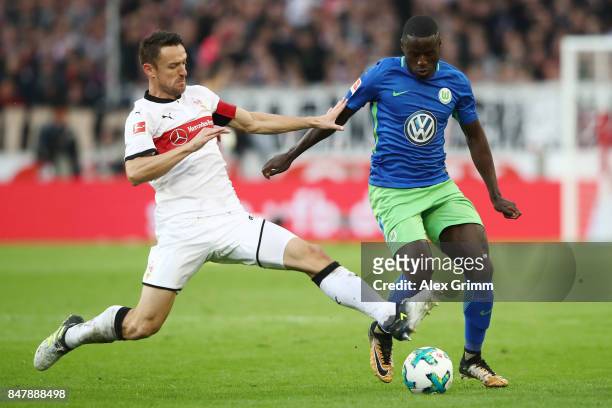 Christian Gentner of Stuttgart fights for the ball with Paul-Georges Ntep of Wolfsburg during the Bundesliga match between VfB Stuttgart and VfL...