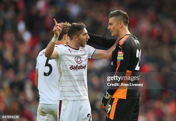 Nick Pope of Burnley with Stephen Ward of Burnley celebrate together after the Premier League match between Liverpool and Burnley at Anfield on...