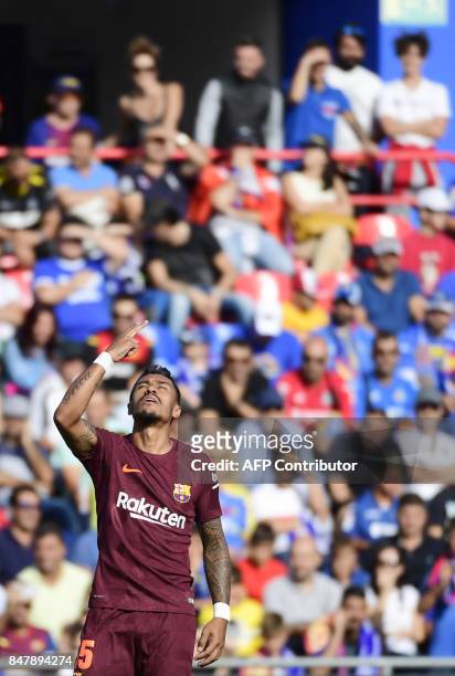 Barcelona's midfielder from Brazil Paulinho celebrates a goal during the Spanish league football match Getafe CF vs FC Barcelona at the Col. Alfonso...