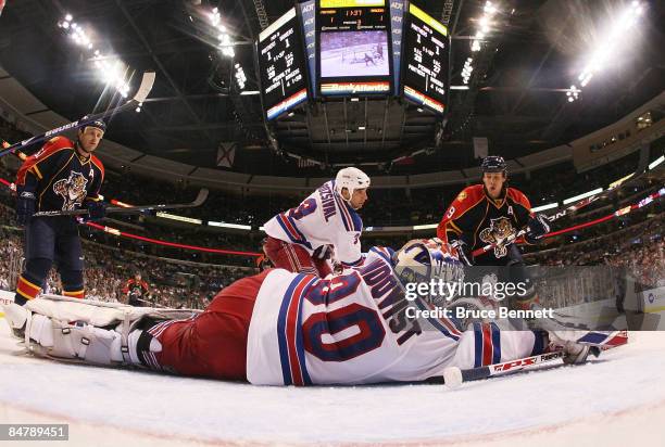 Henrik Lundqvist of the New York Rangers blocks the net against Stephen Weiss of the Florida Panthers on February 13, 2009 at the BankAtlantic Center...