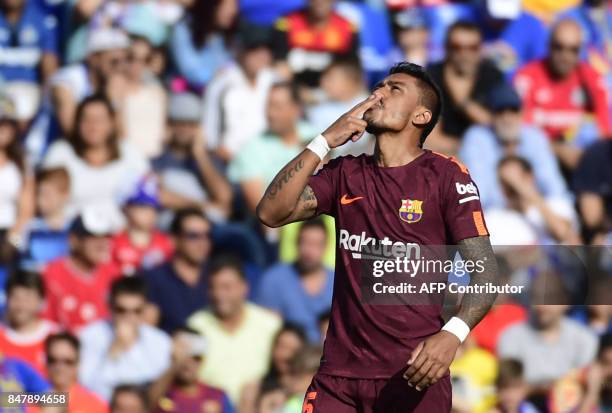 Barcelona's midfielder from Brazil Paulinho celebrates a goal during the Spanish league football match Getafe CF vs FC Barcelona at the Col. Alfonso...