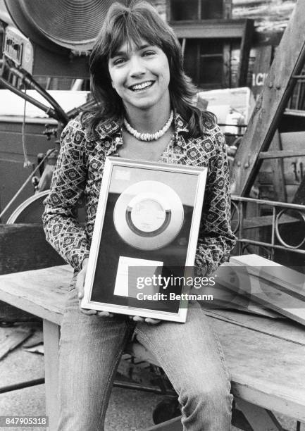 Singer David Cassidy displays his latest Silver Disc award from the United Kingdom, earned when his new record, “Daydreamer” achieved sales in excess...