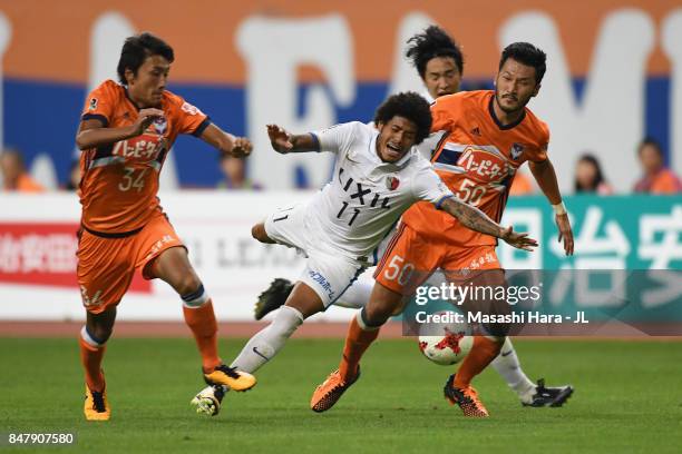 Leandro of Kashima Antlers is challenged by Teruki Hara of Albirex Niigata during the J.League J1 match between Albirex Niigata and Kashima Antlers...