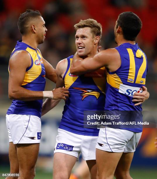 Sam Mitchell of the Eagles celebrates a goal with Lewis Jetta and Sharrod Wellingham of the Eagles during the 2017 AFL First Semi Final match between...