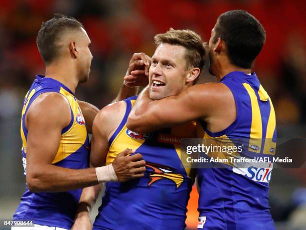 Sam Mitchell of the Eagles celebrates a goal with Lewis Jetta and Sharrod Wellingham of the Eagles during the 2017 AFL First Semi Final match between...