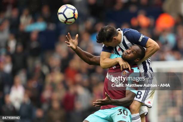 Michail Antonio of West Ham United and Gareth Barry of West Bromwich Albion during the Premier League match between West Bromwich Albion and West Ham...