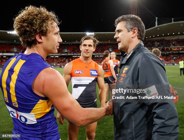 Leon Cameron, Senior Coach of the Giants congratulates Matt Priddis of the Eagles after his last game during the 2017 AFL First Semi Final match...