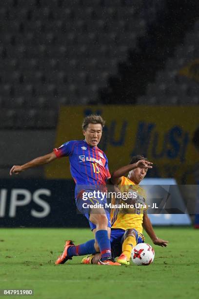 Kensuke Nagai of FC Tokyo and Gakuto Notsuda of Vegalta Sendai compete for the ball during the J.League J1 match between FC Tokyo and Vegalta Sendai...