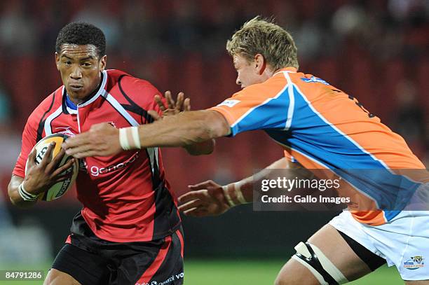 February 2009, Ashwin Willemse of the Lions is tackled by Juan Smith of the Cheetahs during the round one Super 14 match between the Lions and the...