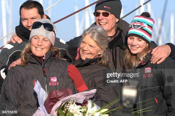 British Samantha Davies poses with her father Paul and her mother Jenny , after she crossed the finish line of the Vendee Globe round-the-world solo...
