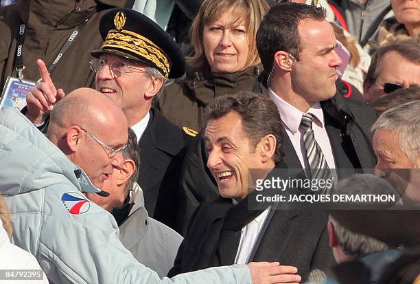 France's President Nicolas Sarkozy meets French Secretary of State for Sport, Bernard Laporte during the women's slalom second run at the World Ski...