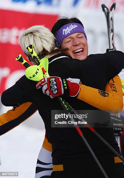 Maria Riesch of Germany celebrates with team mate Fanny Chmelar after winning the Women's Slalom event held on the Face de Bellevarde course on...