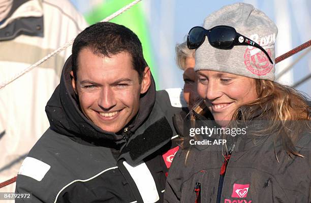 British Samantha Davies is pictured with her boyfriend, skipper Romain Attanasio after she crossed the finish line of the Vendee Globe...