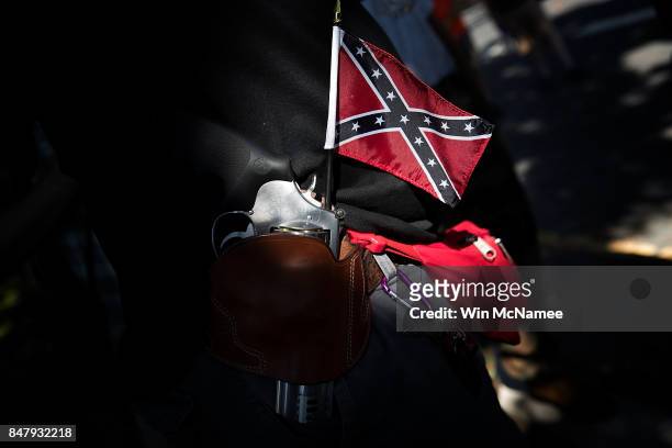 Man carrying a sidearm and confederate flag attends a protest held by the Tennessee based group "New Confederate State of America" September 16, 2017...