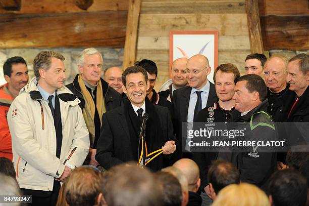 French President Nicolas Sarkozy speaks next to former ski champin Luc Alphan , former French minister Herve Gaymard, agriculture minister Michel...