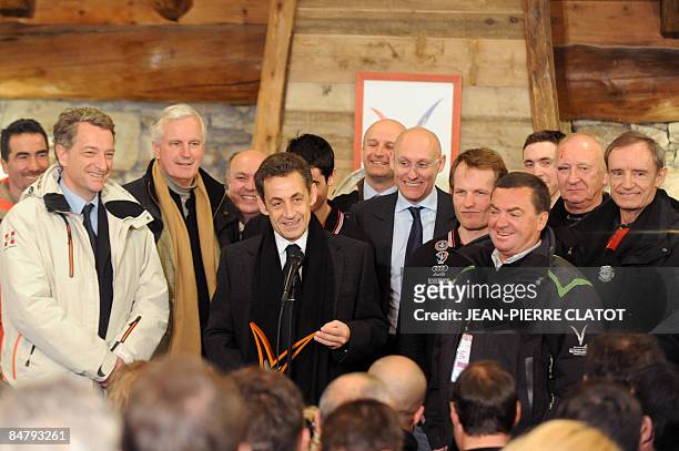 French President Nicolas Sarkozy speaks next to former ski champin Luc Alphan , former French minister Herve Gaymard, agriculture minister Michel...
