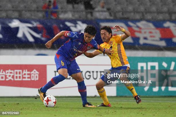 Kosuke Ota of FC Tokyo and Shota Kobayashi of Vegalta Sendai compete for the ball during the J.League J1 match between FC Tokyo and Vegalta Sendai at...