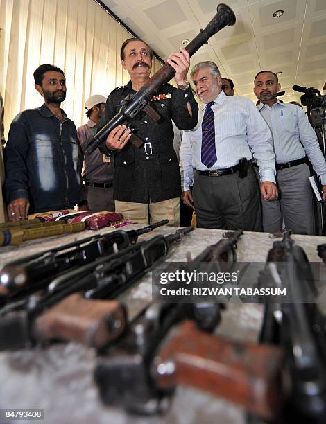 Pakistani province Sindh capital Police Chief Waseem Ahmed shows a weapon recovered from a militant group in Karachi on February 14, 2009. Karachi...