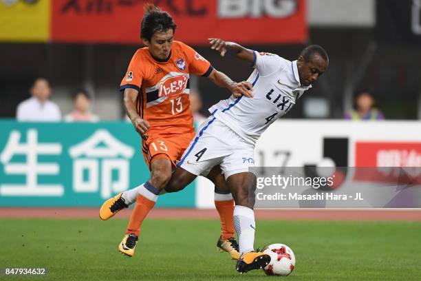 Leo Silva of Kashima Antlers controls the ball under pressure of Masaru Kato of Albirex Niigata during the J.League J1 match between Albirex Niigata...