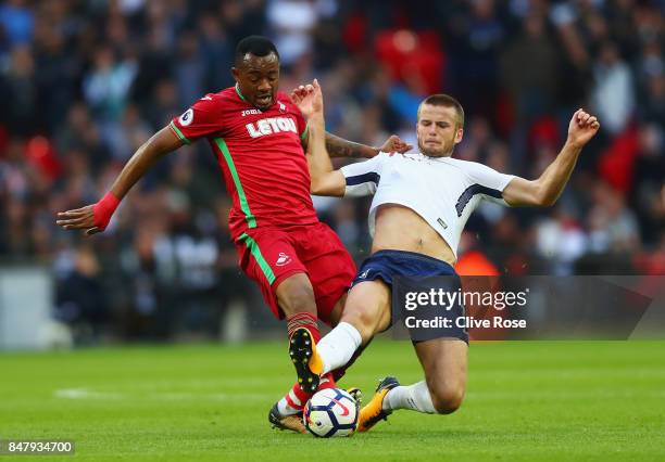 Jordan Ayew of Swansea City and Eric Dier of Tottenham Hotspur battle for possession during the Premier League match between Tottenham Hotspur and...