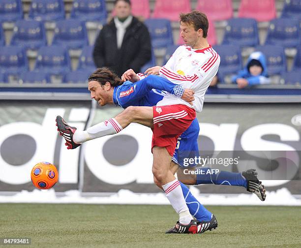 Dinamo Zagreb's Tomo Sokota challenges Red Bull Salzburg's Barry Opdam during their friendly pre-season soccer match in Salzburg, on February 14,...
