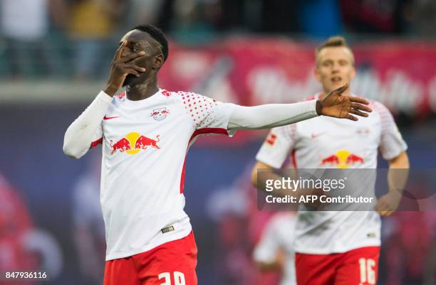 Leipzig's French forward Jean-Kevin Augustin celebrates scoring the 2-1 goal during the German first division Bundesliga football match RB Leipzig v...