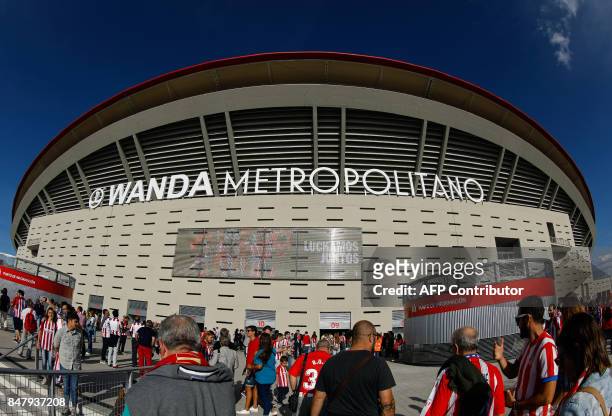 People arrive at the new Wanda Metropolitano stadium before the Spanish league football match Club Atletico de Madrid vs Malaga CF in Madrid on...