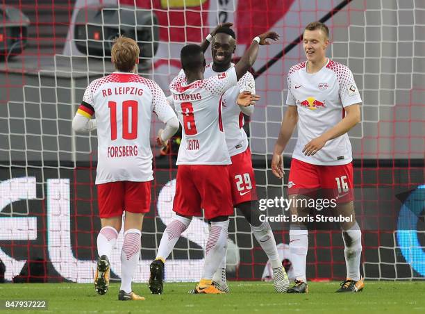 Jean-Kevin Augustin of Leipzig is celebrated after he scored his teams second goal to make it 2:1 during the Bundesliga match between RB Leipzig and...