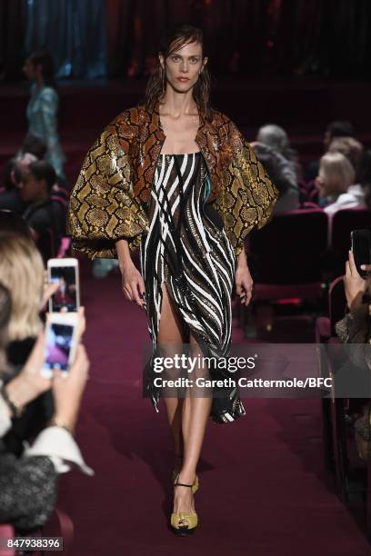 Aymeline Valade walks the runway at the Halpern show during London Fashion Week September 2017 on September 16, 2017 in London, England.